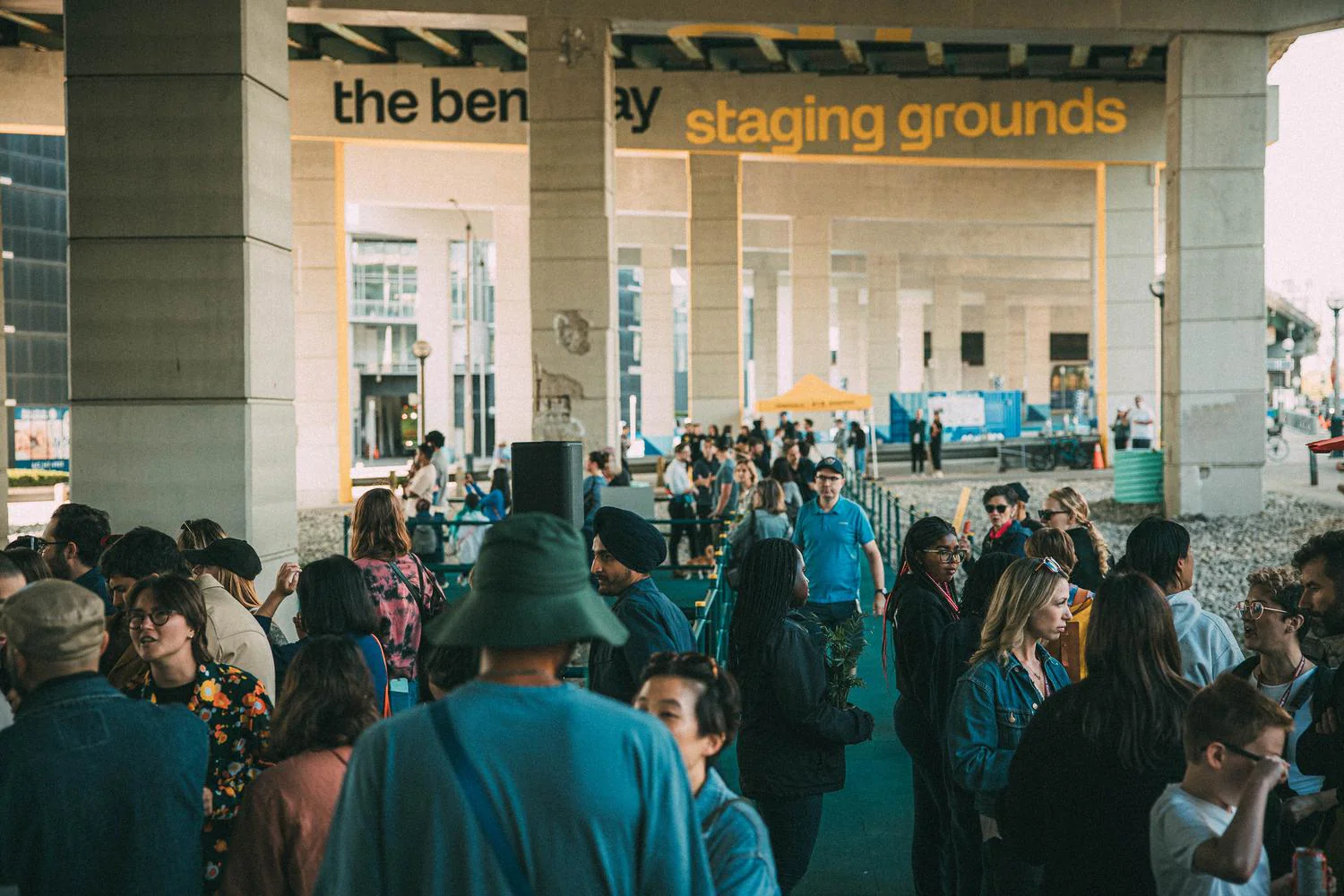 People gathered at Staging Grounds beneath the Gardiner Expressway